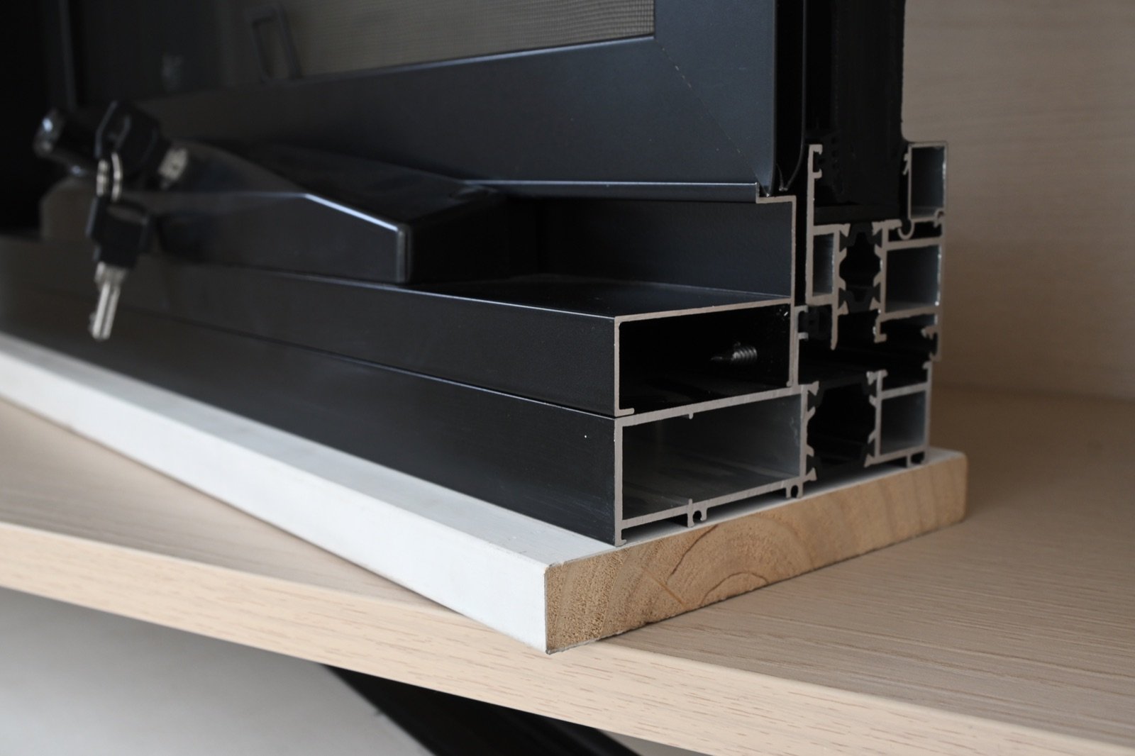Close-up review of an insulated aluminum window profile and hardware