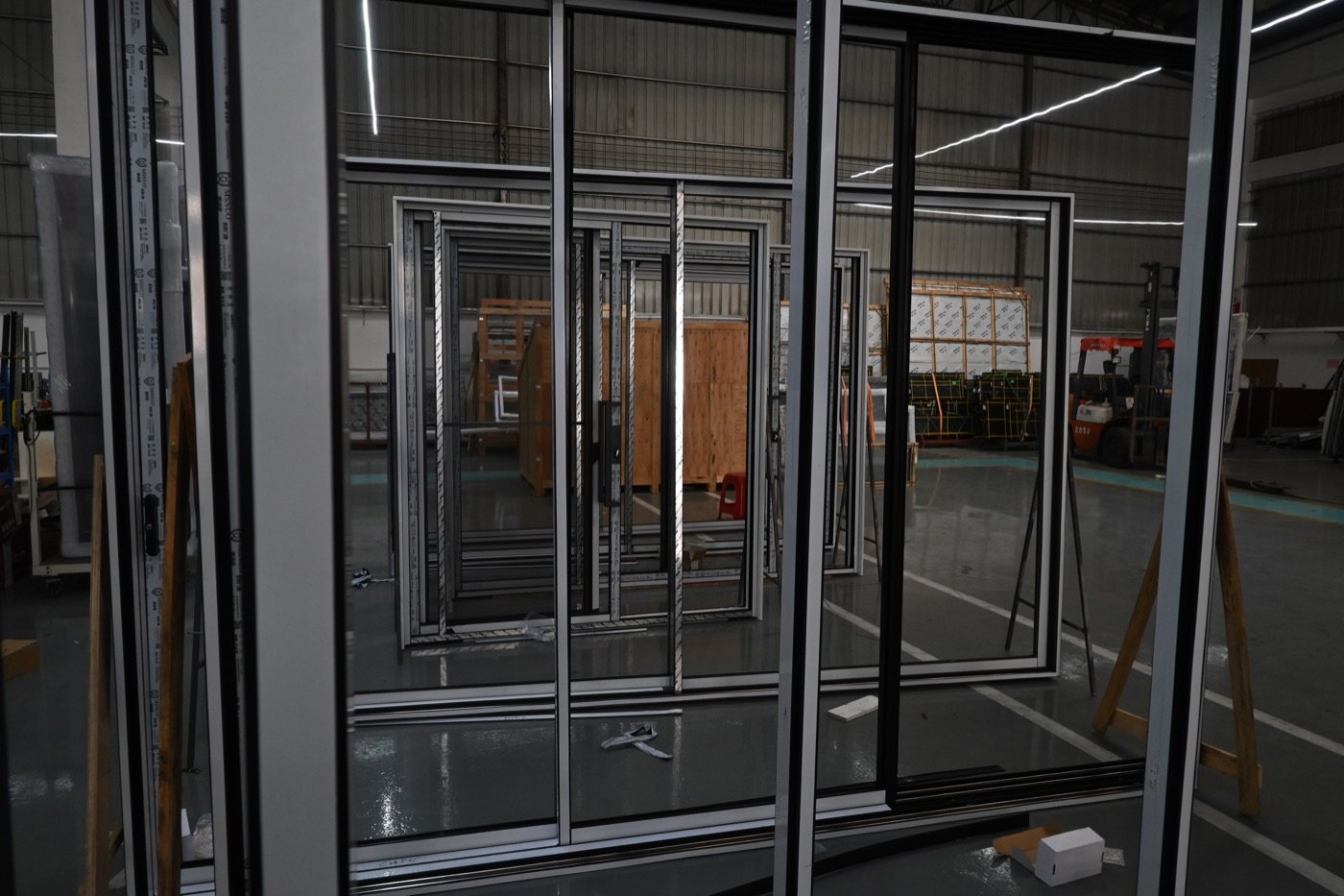 Large aluminum door unit on the factory floor